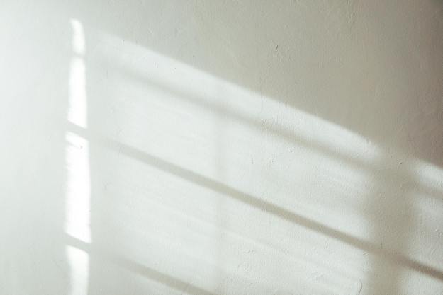 white wall with sunlight and shadow